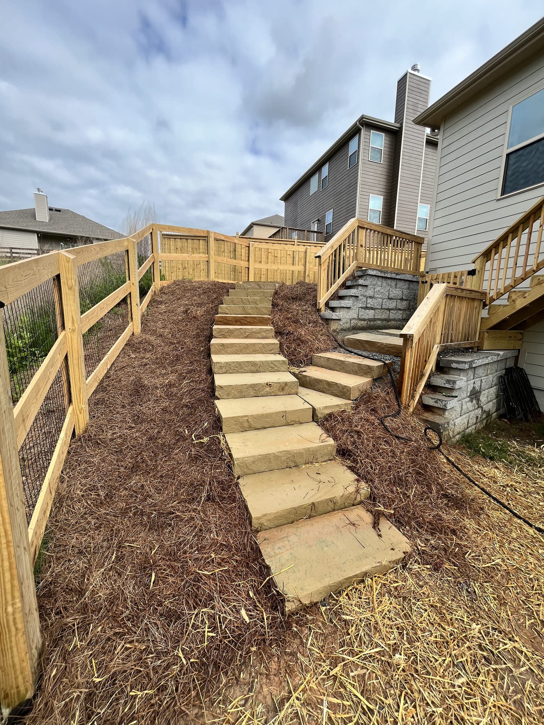 Timber steps and mulch on a graded slope