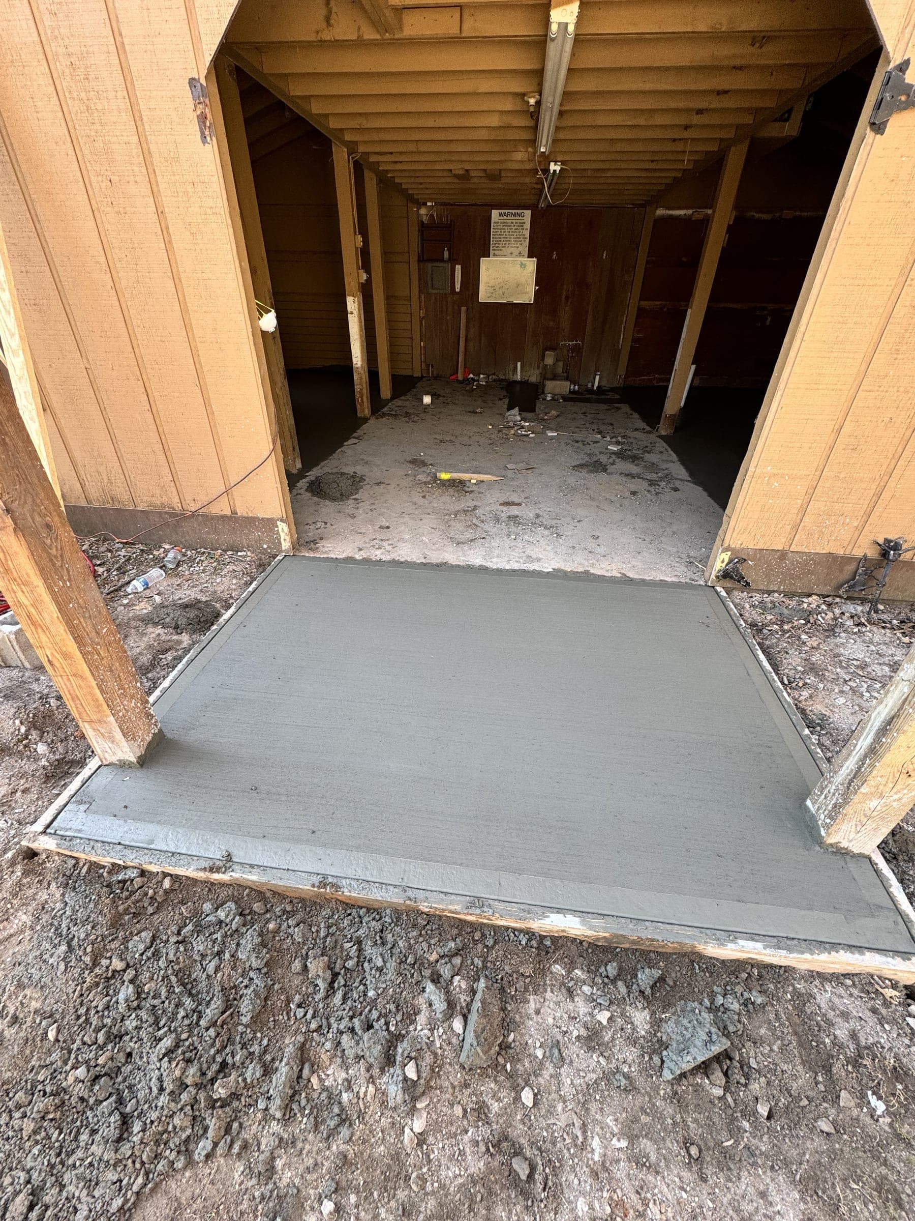 New concrete entry slab at a side door